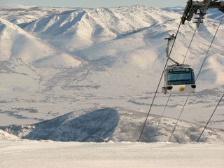 Snowbasin's slopes overlook Utah's peaceful Ogden Valley. (photo: FTO/Marc Guido)