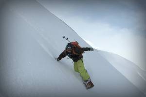 Professional snowboarder with Type 1 diabetes, Sean Busby of Fountain Green, Utah, rides remote summits near Dalvik, Iceland.