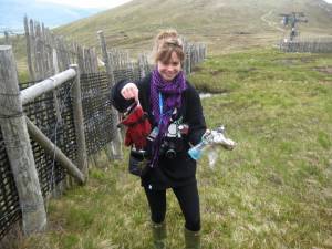 Rosie Barcroft picks up litter at Nevis Range ski area in Scotland as part of the Ski Club of Great Britain's Big Spring Clean initiative. (photo: Ski Club of Great Britain)