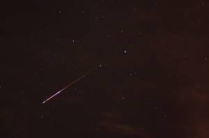 A meteor streaks across the sky during the Perseid Meteor Shower. (photo: Jared Tennant)