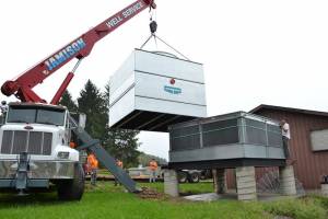 Construction workers lift into place a new snowmaking water cooling tower at Ohio's Snow Trails ski resort. (photo: Snow Trails)