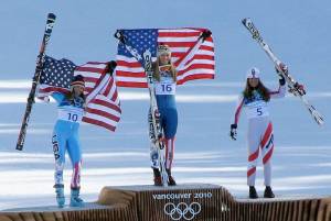 Julia Mancuso, left, takes her place on the 2010 Winter Olympic Downhill podium with fellow American Lindsey Vonn and Elisabeth Görgl of Austria. (photo: Eileen)