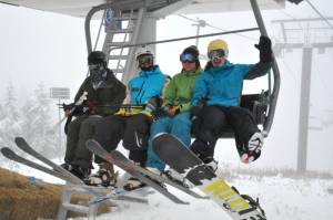 Happy skiers and riders brave fog and drizzle Tuesday at Cypress Mountain, the first ski resort in British Columbia to open this season. (photo: Cypress Mountain)