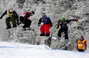 World Cup riders compete in snowboard cross in Bad Gastein, Austria, in 2010. (photo: FIS/Oliver Kraus)