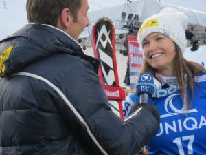 Julia Mancuso interviews with German television after finishing second in the Bad Kleinkirchheim, Austria downhill for her third podium of the World Cup season. (photo: Doug Haney/U.S. Ski Team)