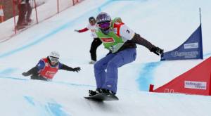 American snowboarder Lindsey Jacobellis, in green, storms to World Cup snowboard cross victory on Sunday in Veysonnaz, Switzerland. (photo: FIS/Oliver Kraus)