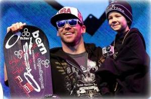 Nick Baumgartner, of Iron River, Mich., with son Landon after winning 2011 Winter X Games SBX gold.