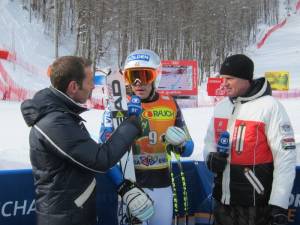 Bode Miller speaks with German television after finishing fourth in downhill portion of super combined in Sochi, Russia on Sunday. (photo: Doug Haney/U.S. Ski Team)