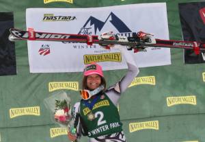 Julia Mancuso hoists her skis after winning the Nature Valley U.S. Alpine Championships giant slalom for the record 15th national title of her career on Saturday in Winter Park, Colo. (photo: USSA/Sarah Brunson)