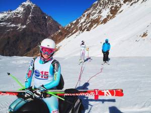 Abby Ghent, foreground, and Lindsey Vonn using the "high speed" lift for training (a.k.a. a snowmobile) at Ski Portillo in Chile while wearing new Vail Beaver Creek 2015 race bibs. (photo: Kristian Saile)