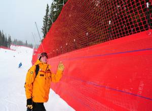 Brad Williams of World Cup Supply checks some of the more than seven miles of netting at the U.S. Ski Team Speed Center at Copper Mountain in Colorado, with full length downhill training for the U.S. Ski Team. (photo: USSA/Tom Kelly)