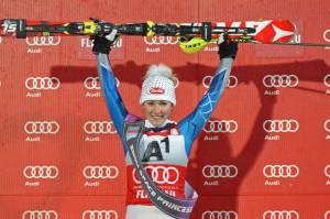 Mikaela Shiffrin of Eagle, Colo., holds her skis in the air on the podium after winning Wednesday night's Audi FIS Alpine Ski World Cup Slalom race in Flachau, Austria. (photo: Mitchell Gunn/ESPA)