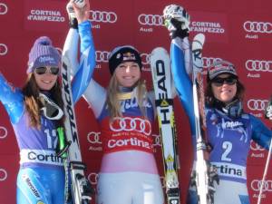 Lindsey Vonn, of Vail, Colo., stands atop the podium on Saturday after winning the Audi FIS Alpine World Cup downhill in Cortina d'Ampezzo, Italy. She is flanked by World Cup Overall leader Tina Maze of Slovenia, left, and third place finisher Leanne Smith, of North Conway, N.H. (photo: Doug Haney/U.S. Ski Team)