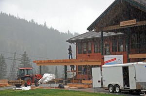 Crews work in snowfall on Monday to construct the new sun deck on Schweitzer's Taps Lounge. (photo: Schweitzer Mountain Resort)