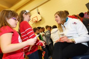 Canadian ski cross athlete Georgia Simmerling, of West Vancouver, B.C., chats with elementary school students in Calgary, Alberta, on Monday. (photo: Malcolm Carmichael)