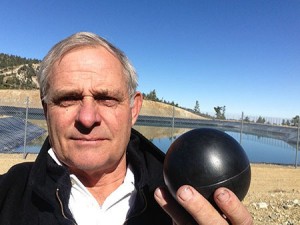 Ron Ellingson, President of Mt. Baldy Ski Lifts, with one of the four-inch plastic balls that will coat the surface of the ski area's snowmaking reservoir. (photo: PRNewsFoto/Mt. Baldy Ski Lifts Inc.)