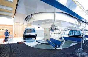 The "Panorama Bahn" hybrid lift in Kitzbühel, Austria. Chairs load from the station on the left of this image, gondolas along the carpeted area to the right. (file photo: Sunday River)