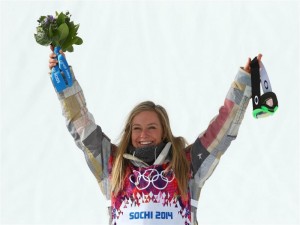 Gold medalist Jamie Anderson of South Lake Tahoe, Calif., celebrates during the flower ceremony for the Women's Snowboard Slopestyle Finals during day 3 of the Sochi 2014 Winter Olympics at Rosa Khutor Extreme Park on Sunday. (photo: Sochi2014)