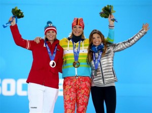 Julia Mancuso, of Squaw Valley, Calif., right, appears on the podium with gold medal winner Maria Hoefl-Riesch of Germany (center) and silver winner Nicole Hosp of Austria (left) at Monday's Olympic medal ceremony in women's super combined skiing. (photo: Sochi2014)