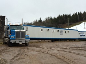 Temporary trailers have begun arriving at Poley Mountain to replace the ski resort's base lodge that was destroyed by fire earlier this month. (photo: Poley Mountain)