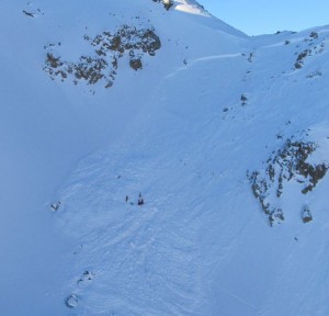 Rescuers search avalanche debris on Tuesday looking for the Italian victim of the slide in Gargellen, Austria. (police photo)