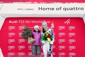 Tamara McKinney, the last American woman to win slalom in Aspen in 1981, poses on the podium with Saturday's winner, Mikaela Shiffrin. (photo: Sarah Brunson/U.S. Ski Team)