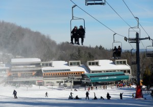 Jackie Wells and James Didyoung from the Montclair (N.J.) State University Outdoor Adventure Program were riding a lift at Whiteface Mountain near Lake Placid, N.Y. within the first hour of their Learn to Ski lesson on Friday. (photo: FTO/Martin Griff) 