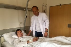 Dr Michael Gabl checks in on super G world champion Hannes Reichelt following back surgery at a hospital in Innsbruck, Austria. (photo: Aichner / ÖSV)