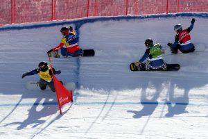 Alessandro Haemmerle (AUT) in blue, Alex Deibold (USA) in red, Nick Baumgartner (USA) in green and Cole Johnson (USA) in yellow compete in heat 4 Finals at Sunday's SBX World Cup in Feldberg, Germany. (photo: Oliver Kraus)