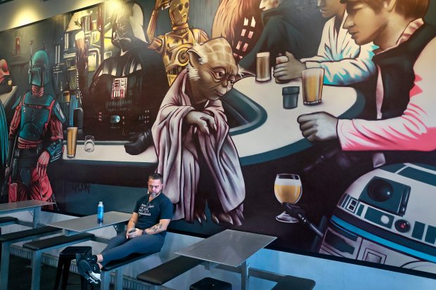 Johnathan Wakefield inside his Star Wars-themed taproom in Wynwood, J. Wakefield Brewing. It is scheduled to close Sunday, Oct. 27, after nearly a decade in business. (Mike Stocker/South Florida Sun Sentinel)