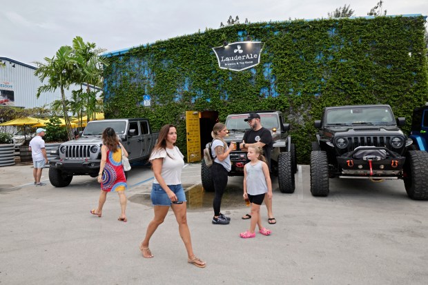 Patrons outside LauderAle Brewery, which marked its 10th anniversary in July 2024 in Fort Lauderdale. (John McCall/South Florida Sun Sentinel file)