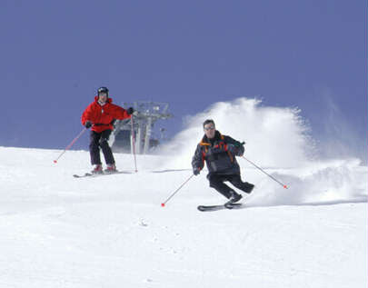 The author and Skip King carve up Courchevel corduroy. (photo: P. Pachod)