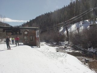 Red River's Copper Chair scoops waiting skiers and snowboarders across the ski area's namesake creek