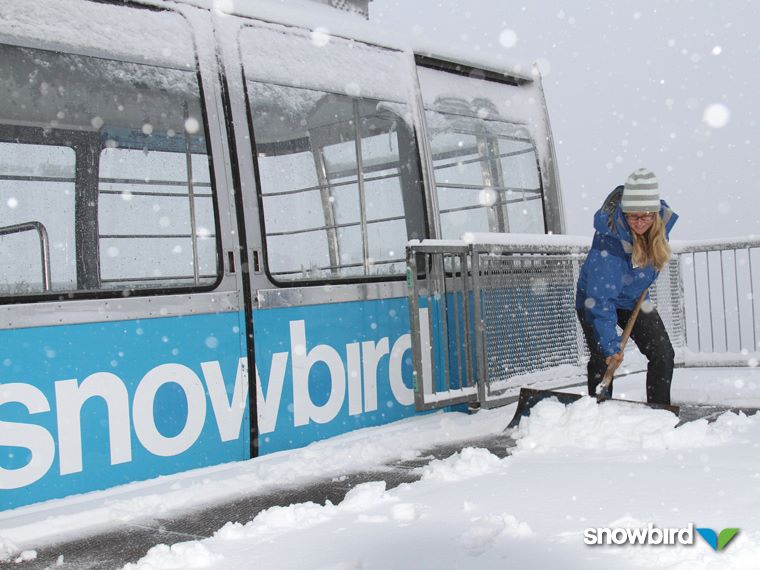 Snowbird's Emily Moench shovels snow from the tram dock atop Hidden Peak (photo: Dave Fields)