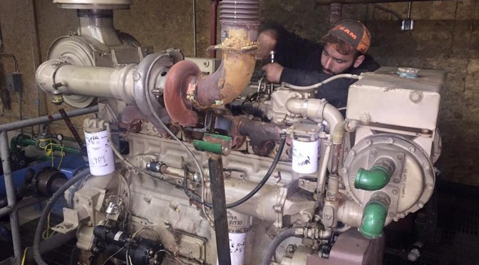 Crews work to repair a seized diesel snowmaking compressor engine as part of Tenney Mountain's rebirth. (photo: Tenney Mountain Facebook)