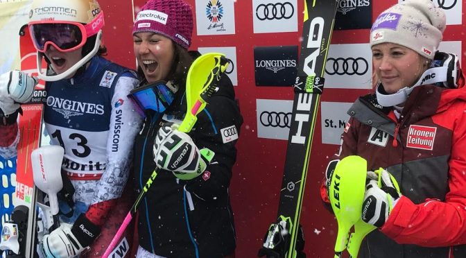 (L to R) Michelle Gisin, Wendy Holdener and Michaela Kirchgasser celebrate in the leader's box at the conclusion of the Women's Super Combined at the 2017 FIS Alpine World Ski Championships in St. Moritz, Switzerland today. (photo: FIS)